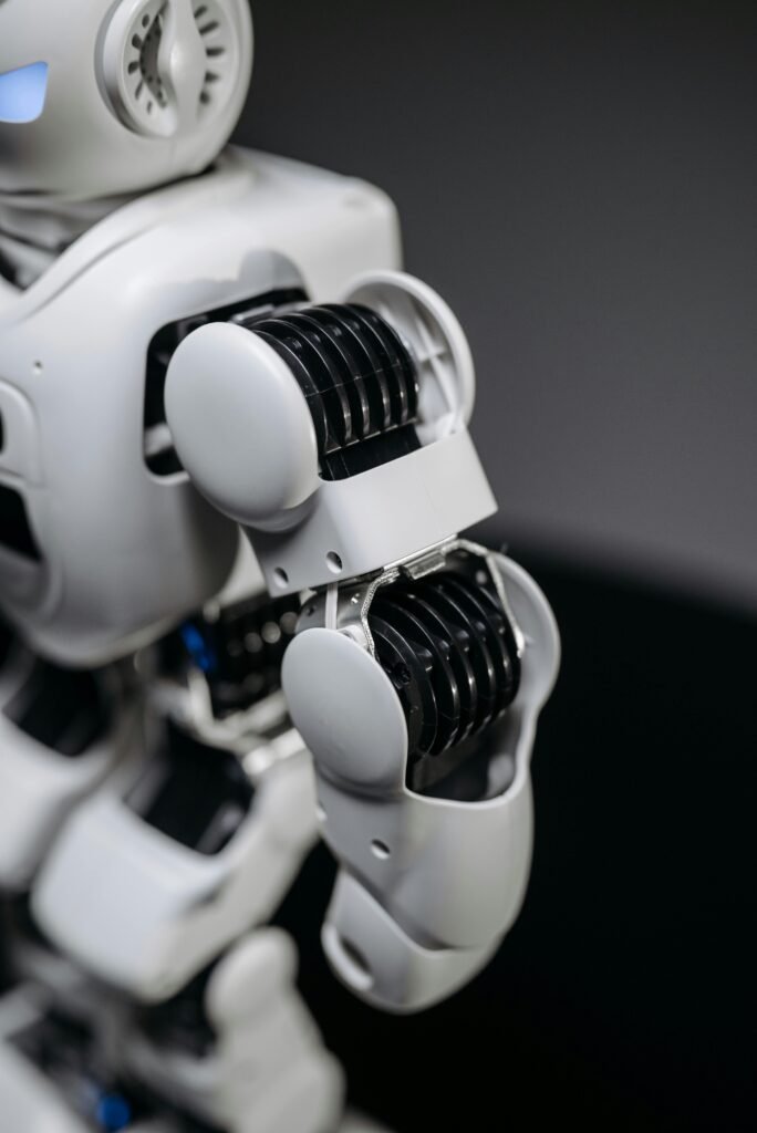 pexels photo 8294553 8294553 Close-up of a humanoid robot's mechanical arm showcasing advanced technology.